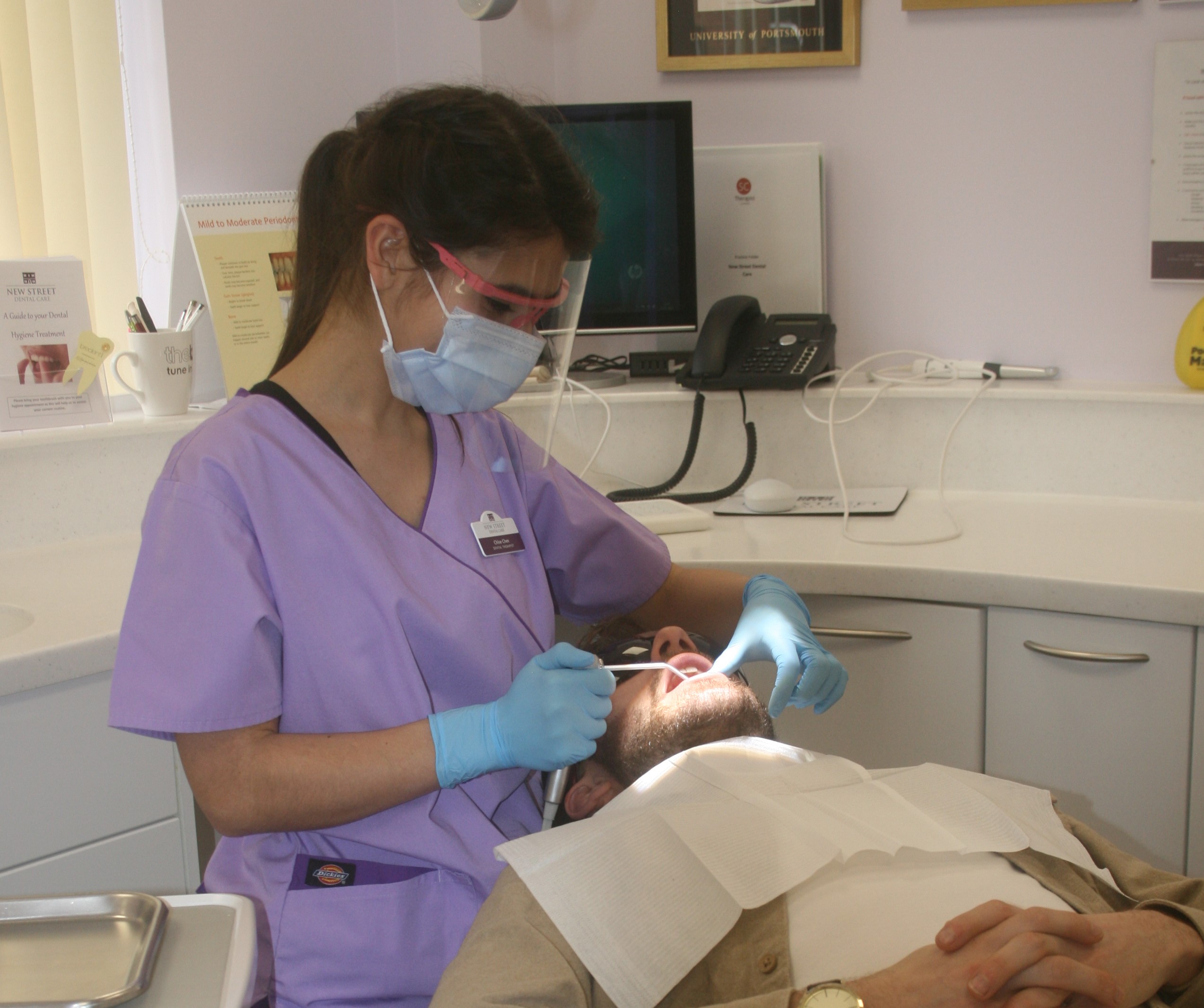 Chloe the Dental Hygienist at New Street Dental Care in Andover checking the health of teeth and gums